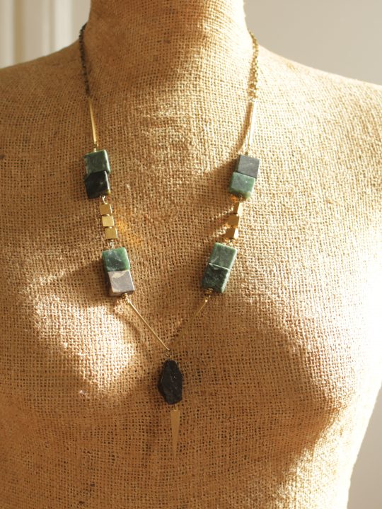 Geometric green marble necklace hangs 26 inches long with a 2.5 inch extender