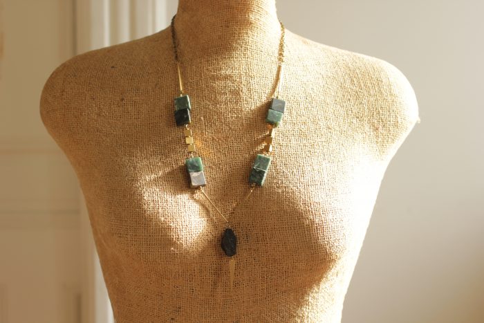 Geometric green marble necklace hangs 26 inches long with a 2.5 inch extender