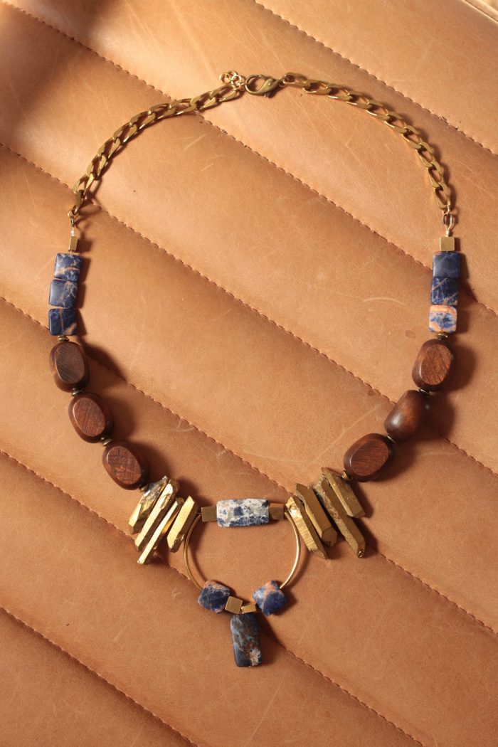 Statement necklace features blue, gold and warm brown colors