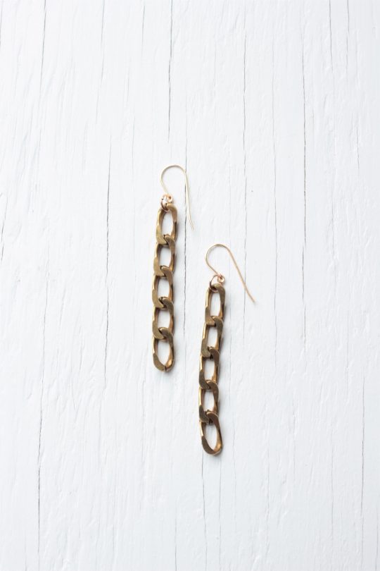 Bold chain link earrings on white background