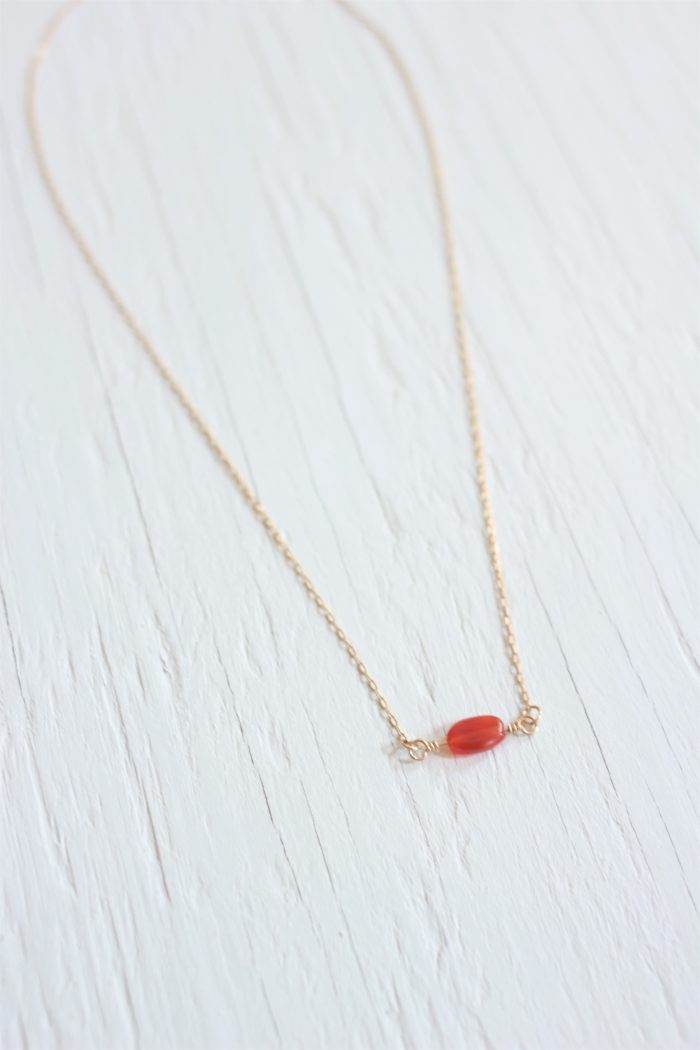 Delicate carnelian necklace on a gold chain
