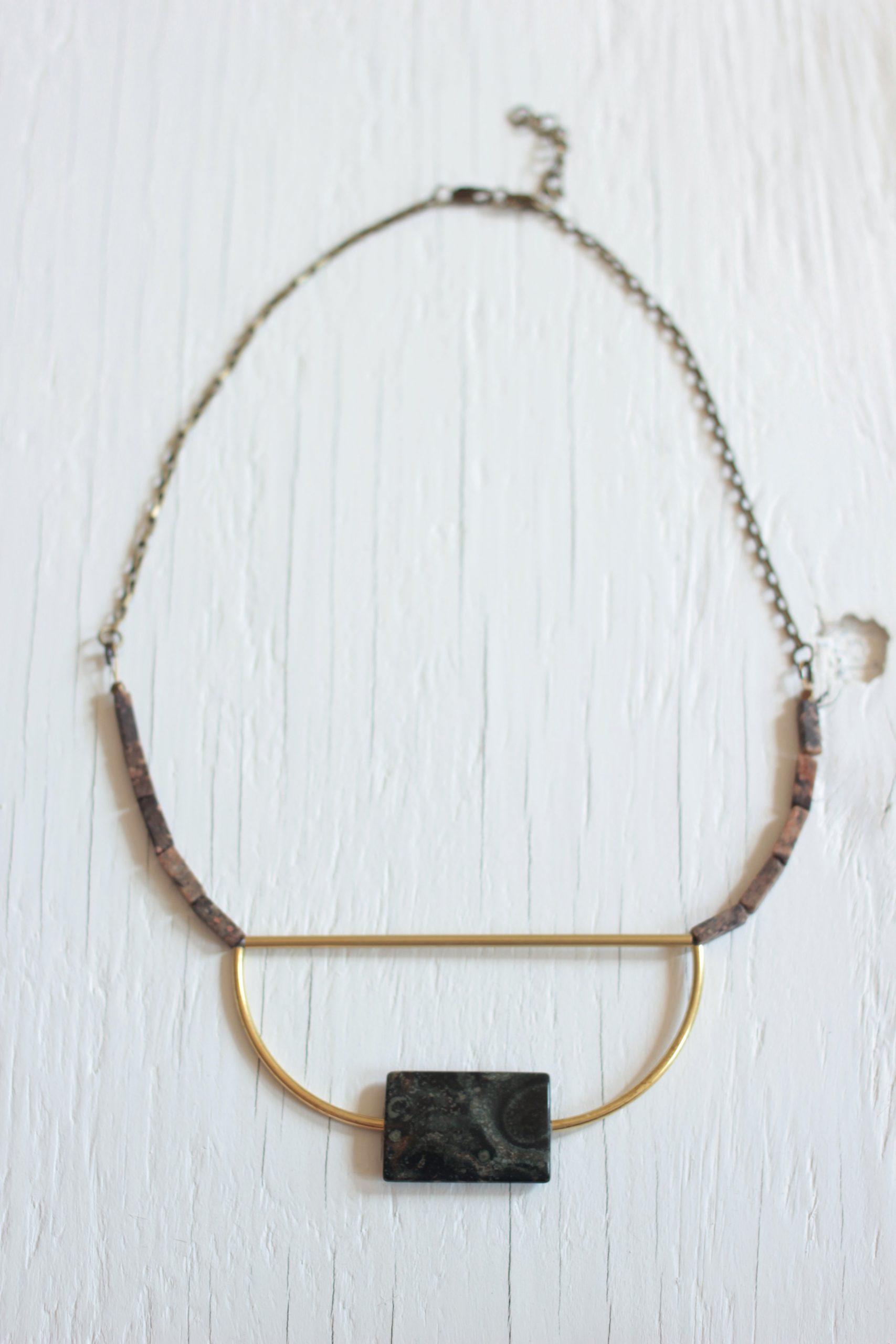 Green stone bib necklace with brass bars